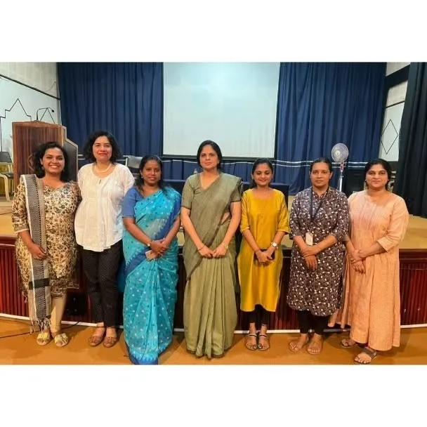 Therapists standing together after a presentation